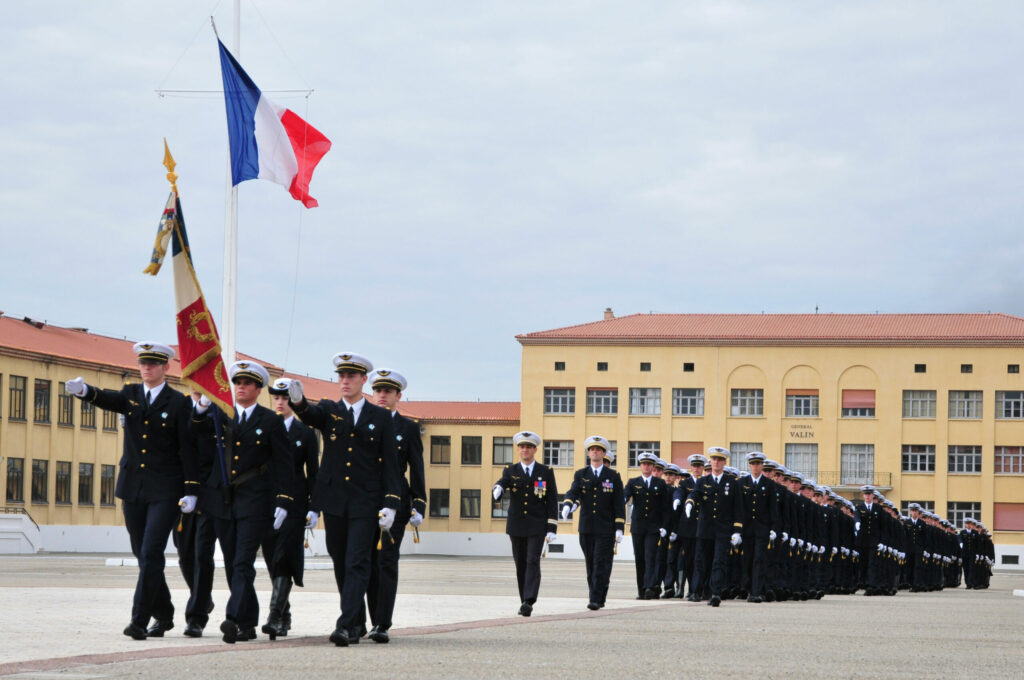 Flag Guard of the French Air and Space Academy preceding the students parading on Place Pelletier Doisy